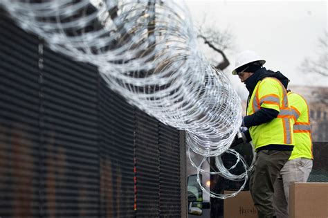 white house fence razor wire